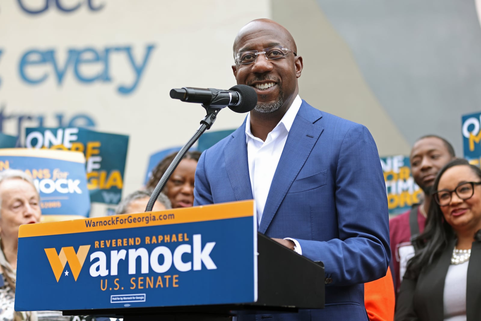 U.S Senate Sen. Raphael Warnock, who is seeking reelection in a runoff bid with Republican Herschel Walker, speaks at the site of the John Lewis mural on Nov. 10, 2022, in Atlanta. (Jason Getz/AJC)