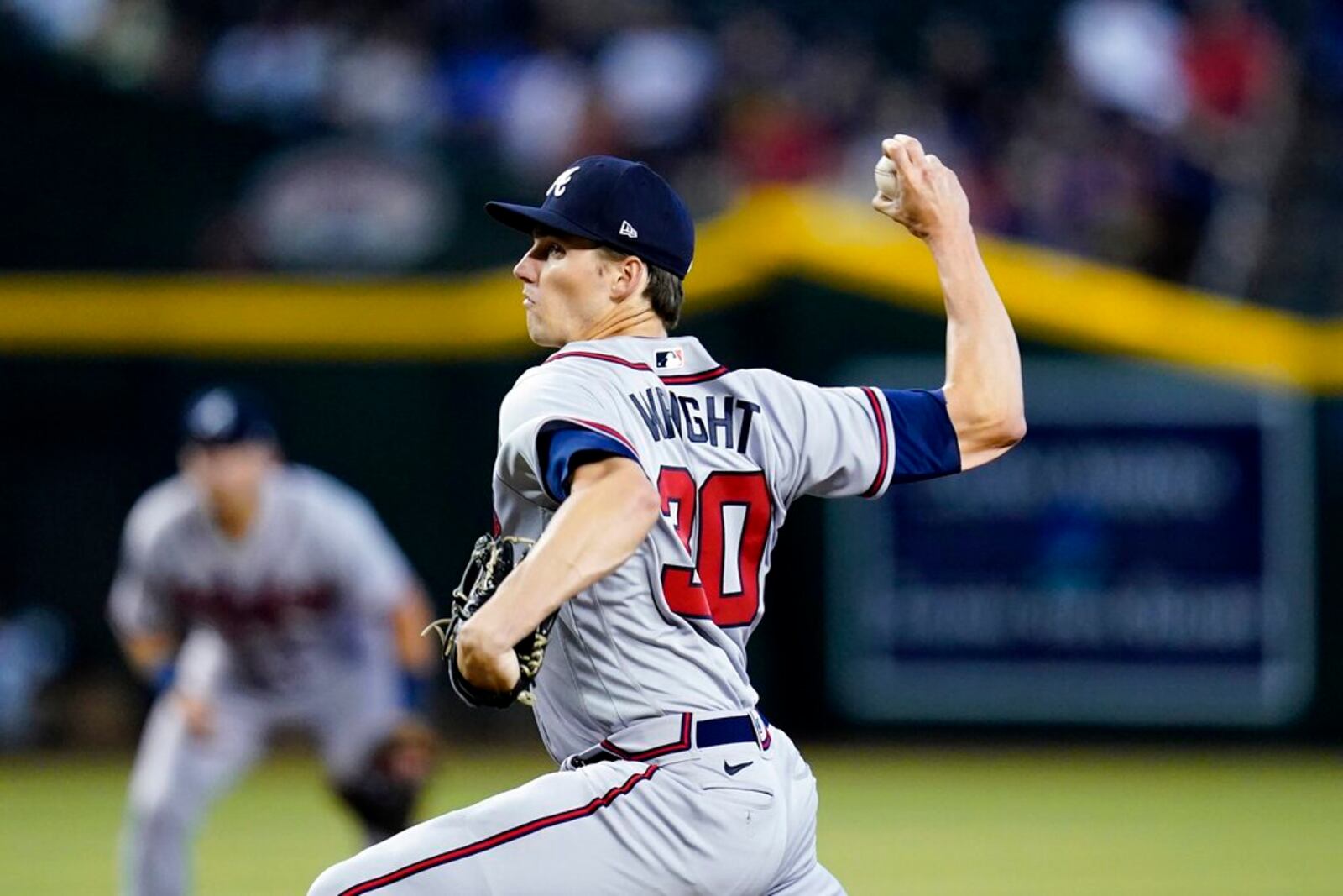 Atlanta Braves starting pitcher Kyle Wright throws a pitch against the Arizona Diamondbacks during the first inning of a baseball game, Wednesday, June 1, 2022, in Phoenix. (AP Photo/Ross D. Franklin)