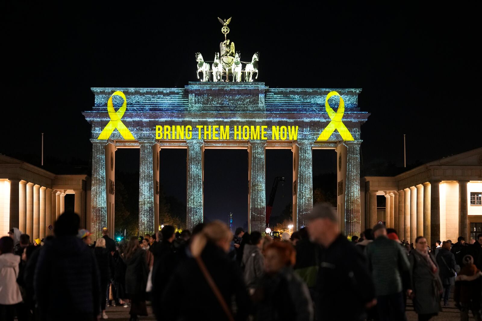 The Brandenburg Gate is illuminated in solidarity with Israel, marking the first anniversary of the Hamas spearheaded attacks on Israel, in Berlin, Germany, Monday, Oct. 7, 2024. (AP Photo/Markus Schreiber)