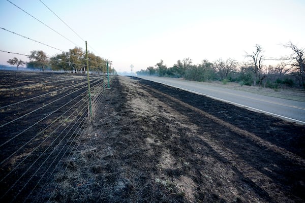 Gillespie County fields are charred along Ranch Road 1631 following the Crabapple Wildfire over the weekend, in Fredericksburg, Texas, Sunday, March 16, 2025. (Robin Jerstad/The San Antonio Express-News via AP)