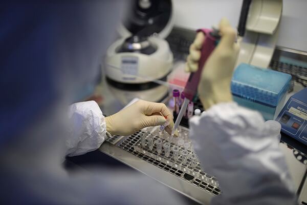 A medical staffer works with test systems for the diagnosis of coronavirus, at the Krasnodar Center for Hygiene and Epidemiology microbiology lab in Krasnodar, Russia.