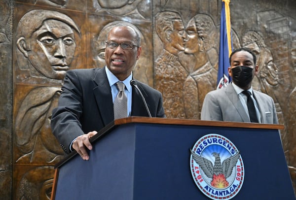 February 3, 2022 Atlanta - Integral Group CEO Egbert Perry speaks as Mayor Andre Dickens looks during a press conference at Atlanta City Hall on Thursday, February 3, 2022. Mayor Andre Dickens announced the settlement at City Hall with Integral Group CEO Egbert Perry and the Atlanta Housing Authority President Eugene Jones. (Hyosub Shin / Hyosub.Shin@ajc.com)