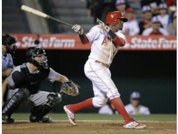 Switch-hitting Erick Aybar will replace Andrelton Simmons at shortstop in 2016 after coming from the Angels along with two top pitching prospect in Thursday's trade for Simmons. (AP photo)