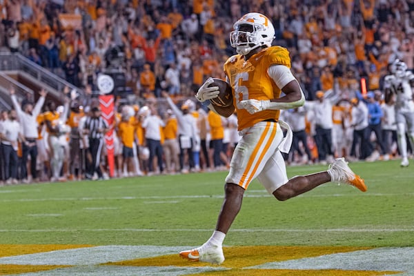 Tennessee running back Dylan Sampson (6) crosses the goal line for a touchdown during the second half of an NCAA college football game against Mississippi State, Saturday, Nov. 9, 2024, in Knoxville, Tenn. (AP Photo/Wade Payne)