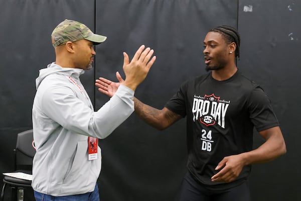 Georgia safety Malaki Starks, right, greets Atlanta Falcons general manager Terry Fontenot after a short chat during the school’s NFL Pro Day at the University of Georgia Indoor Practice Facility, Wednesday, March, 12, 2025, in Athens, Ga. (Jason Getz / AJC)