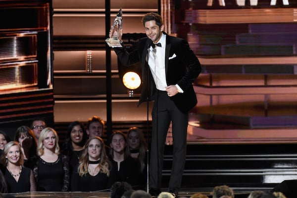 Thomas Rhett and his first-ever CMA Award. (Photo by Gustavo Caballero/Getty Images)