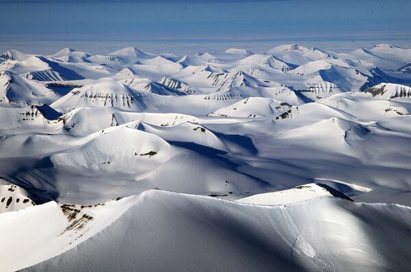 Midnight sun reflects off the face of ridges on the West Coast of Spitsbergen on the morning of Midsummer on June 21, 2008 in Longyearbyen, Norway.