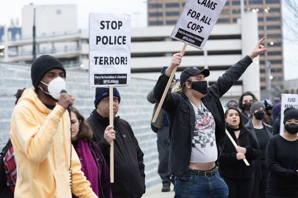 Forest Defender protesters gathered for a rally near Underground Atlanta Saturday, Jan. 21, 2023. Atlanta Police Department said several people were arrested after a Police car was set afire.  (Steve Schaefer/steve.schaefer@ajc.com)