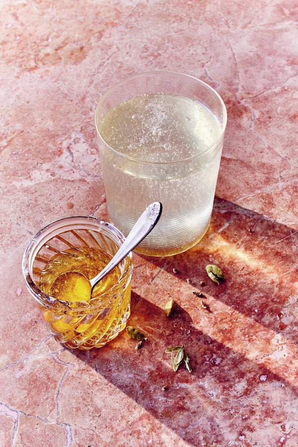 Sharbats combine sweet boiled fruit syrups with cold, still or sparkling water. In this sharbat version published in “Lemonade With Zest” by April White (Chronicle Books, 2018), green cardamom pods recall the drink’s Persian origins. CONTRIBUTED BY GENTL & HYERS