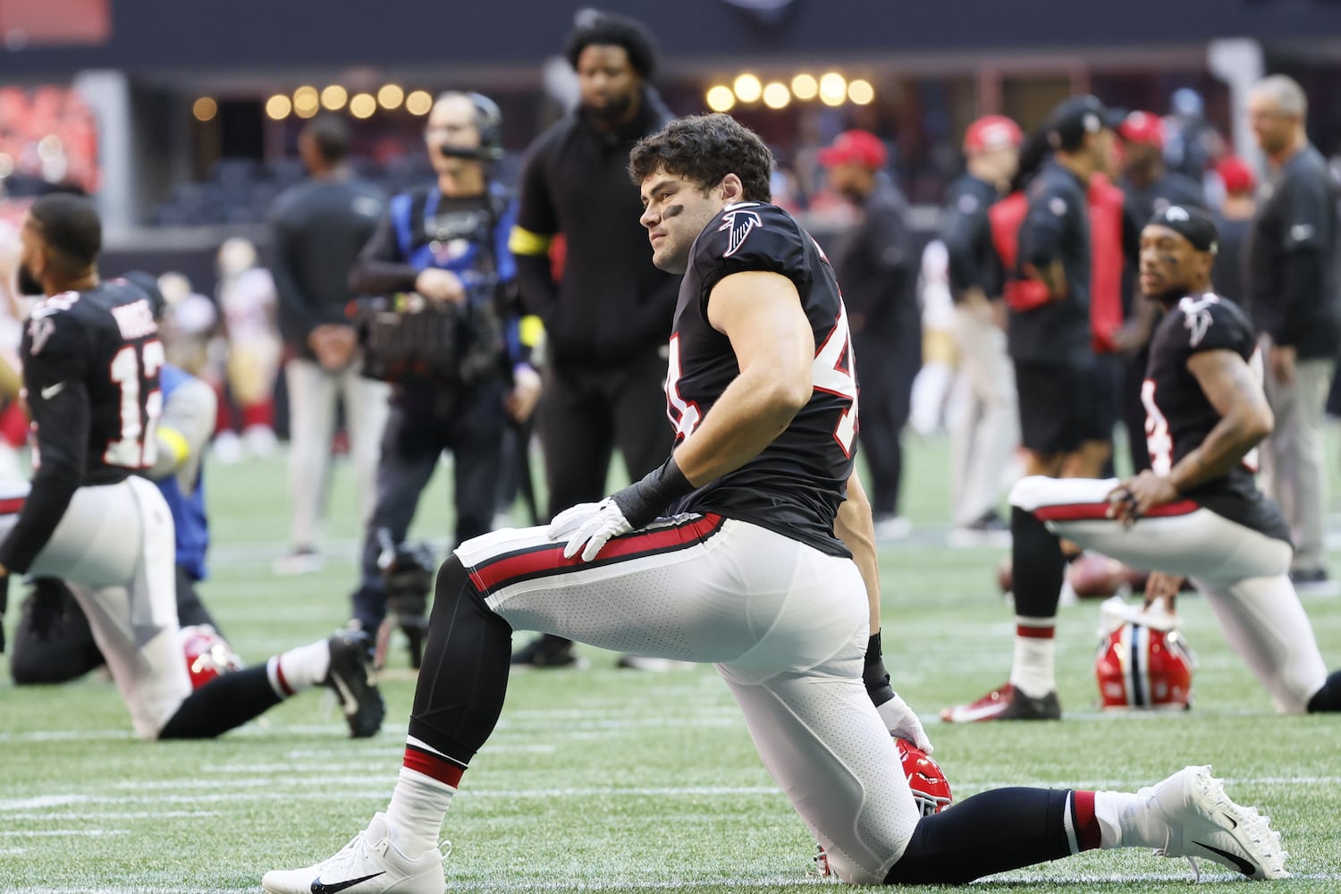 Falcons linebacker Troy Andersen stretches before Sunday's game at Mercedes-Benz Stadium. (Miguel Martinez / miguel.martinezjimenez@ajc.com)