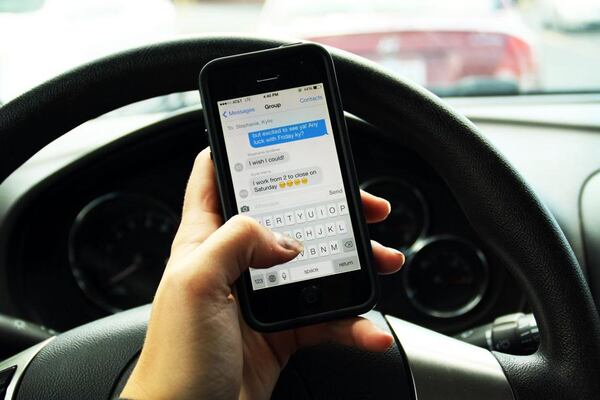 The sponsor of Georgia's distracted driver law is now seeking a repeal of one provision in the legislation that allows first-time offenders to avoid charges if they purchase a hands-free driving device. AJC file photo