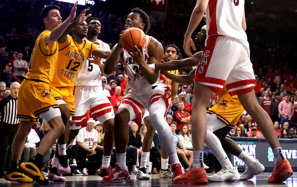 Arizona forward Tobe Awaka (30) tries to get off a put-back in a crowded lane against Arizona State during an NCAA college basketball game in Tucson, Ariz., March 4, 2025. (Kelly Presnell/Arizona Daily Star via AP)