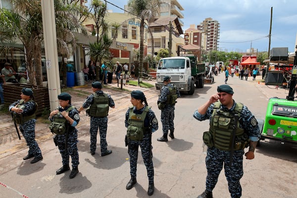 Police block a street leading to the Dubrovnik Hotel where firefighters and rescuers work to find survivors after the hotel collapsed, in Villa Gesell, Argentina, Tuesday, Oct. 29, 2024. (AP Photo/Christian Heit)