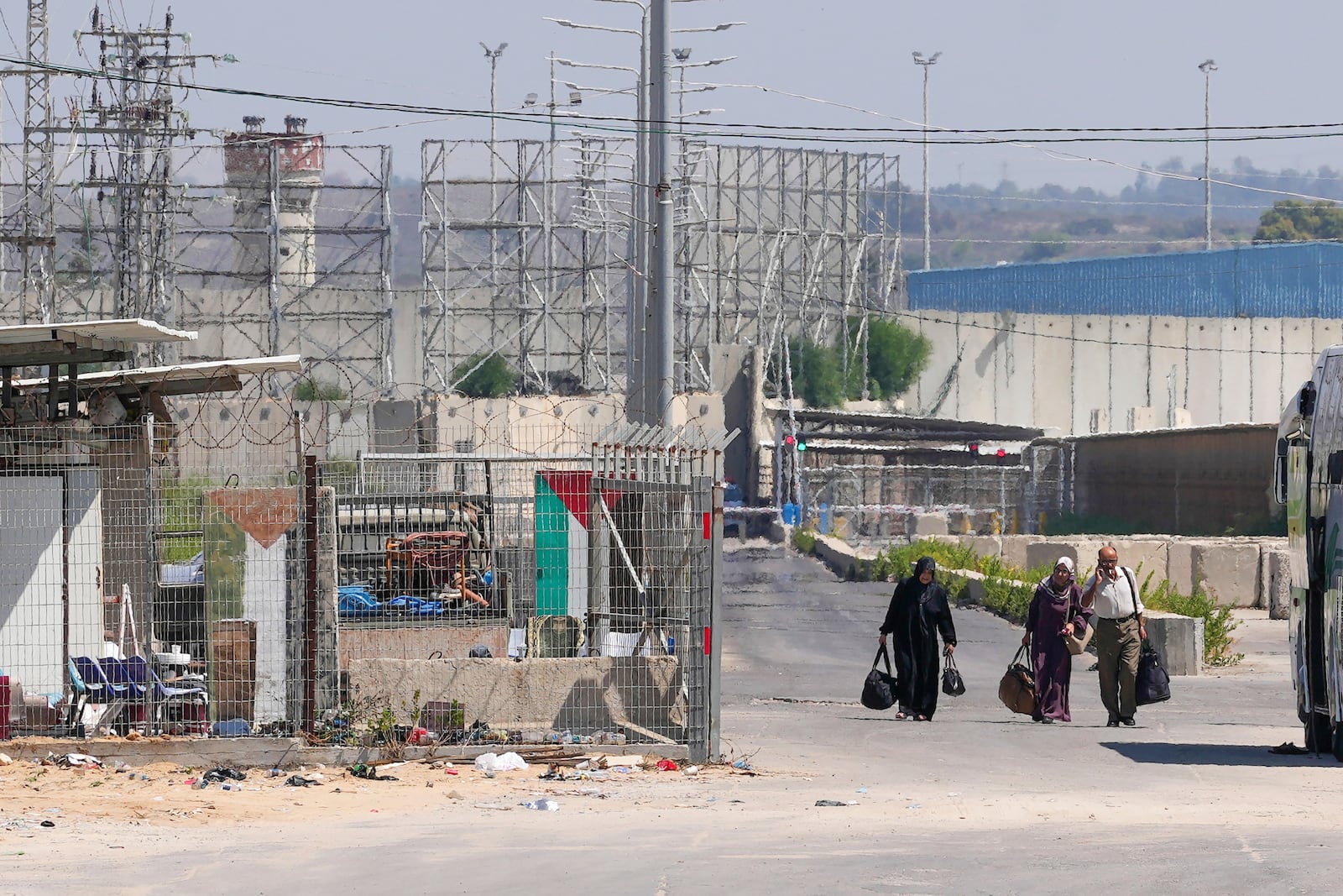 FILE - Palestinian patients carry their belongings on their way back to the Gaza Strip after receiving medical treatment in Israel, near the Erez crossing between Gaza and Israel, in the town of Beit Hanoun, northern Gaza Strip, on Sept. 19, 2023. (AP Photo/Adel Hana)