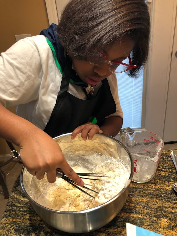 Leigha Samuel mixes a batch of Girl Scout Cookies. Courtesy of Michele Samuel