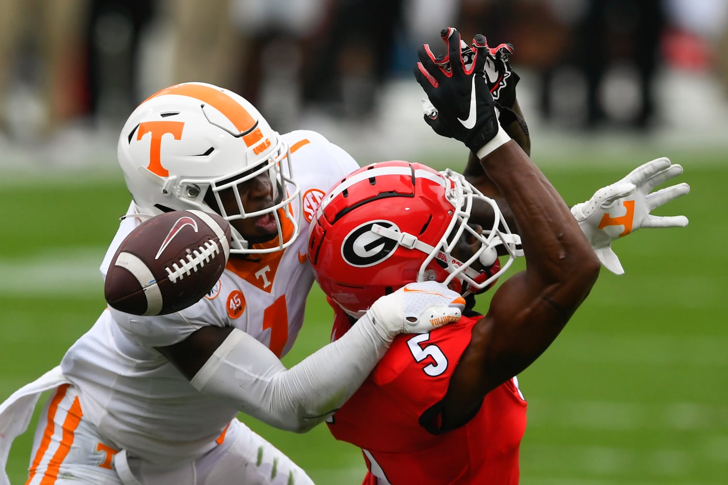 Georgia wide receiver Matt Landers (5) can’t keep a grasp on the ball as Tennessee defensive back Trevon Flowers defends during the first half of a football game Saturday, Oct. 10, 2020, at Sanford Stadium in Athens. JOHN AMIS FOR THE ATLANTA JOURNAL- CONSTITUTION