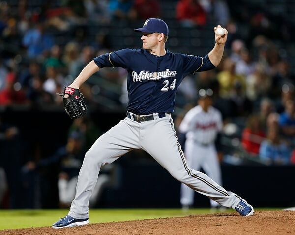 Milwaukee Brewers' Lyle Overbay pitches in the eighth inning of a baseball game against Atlanta Braves, Monday, May 19, 2014, in Atlanta. Atlanta won 9-3. (AP Photo/John Bazemore) Lyle Overbay, shutdown reliever. (John Bazemore/AP)