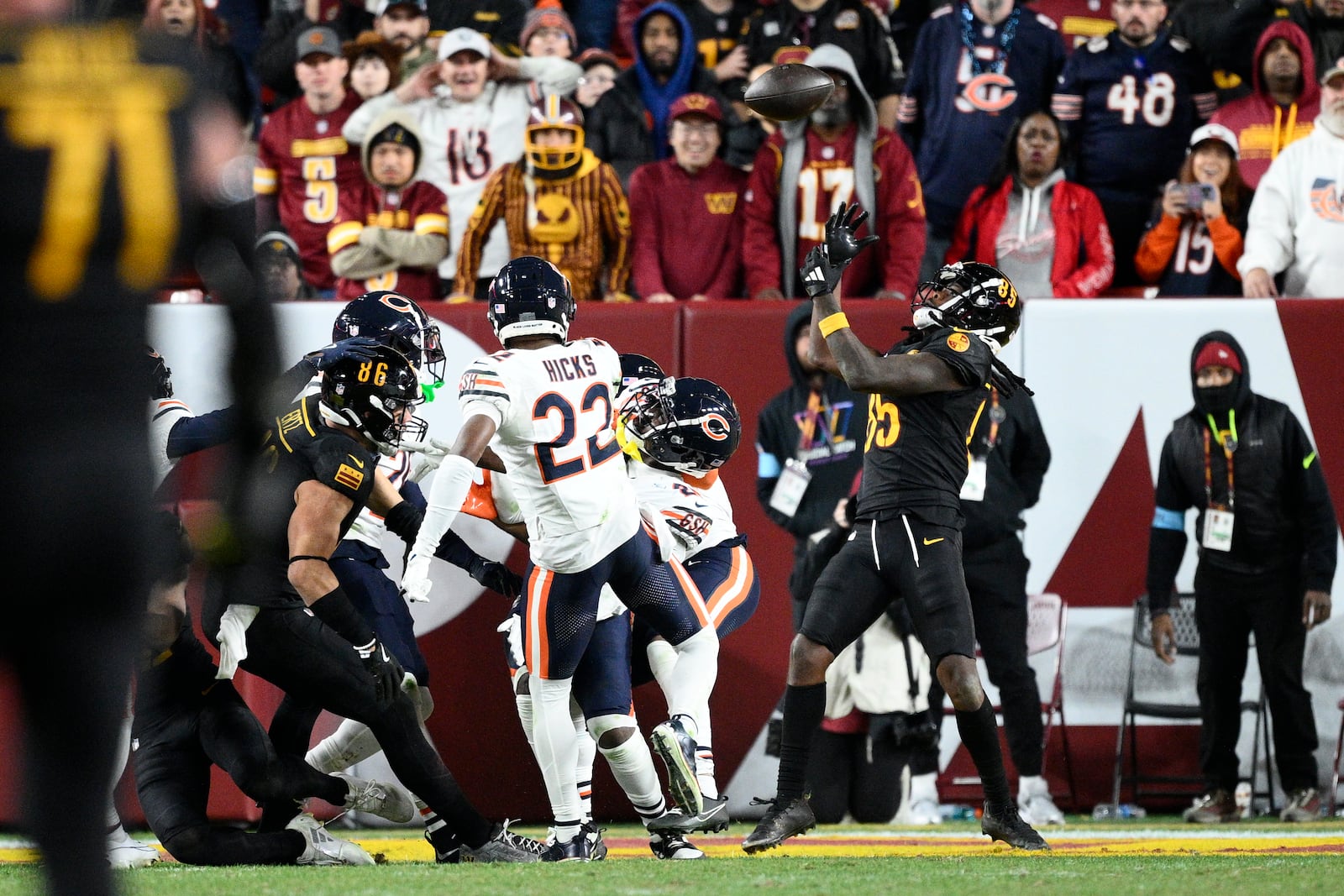 Washington Commanders wide receiver Noah Brown (85) catches a 52-yard touchdown pass in the end zone as time expires to give the Commanders an 18-15 win over the Chicago Bears in an NFL football game Sunday, Oct. 27, 2024, in Landover, Md. (AP Photo/Nick Wass)