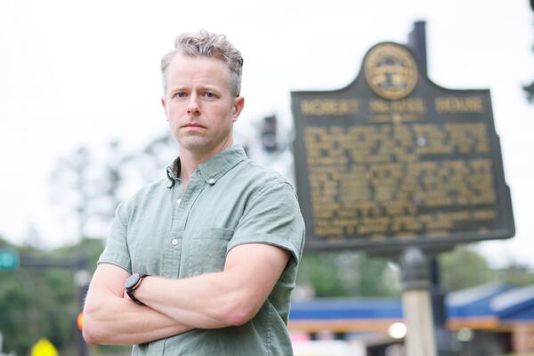 Trevor Beemon, head of Cobb Landmarks and Historical Society, poses outside of a historic home in Marietta; the Eliza and Robert McAfee house is in the midst of a dispute to find a solution for its fate.
Miguel Martinez /miguel.martinezjimenez@ajc.com