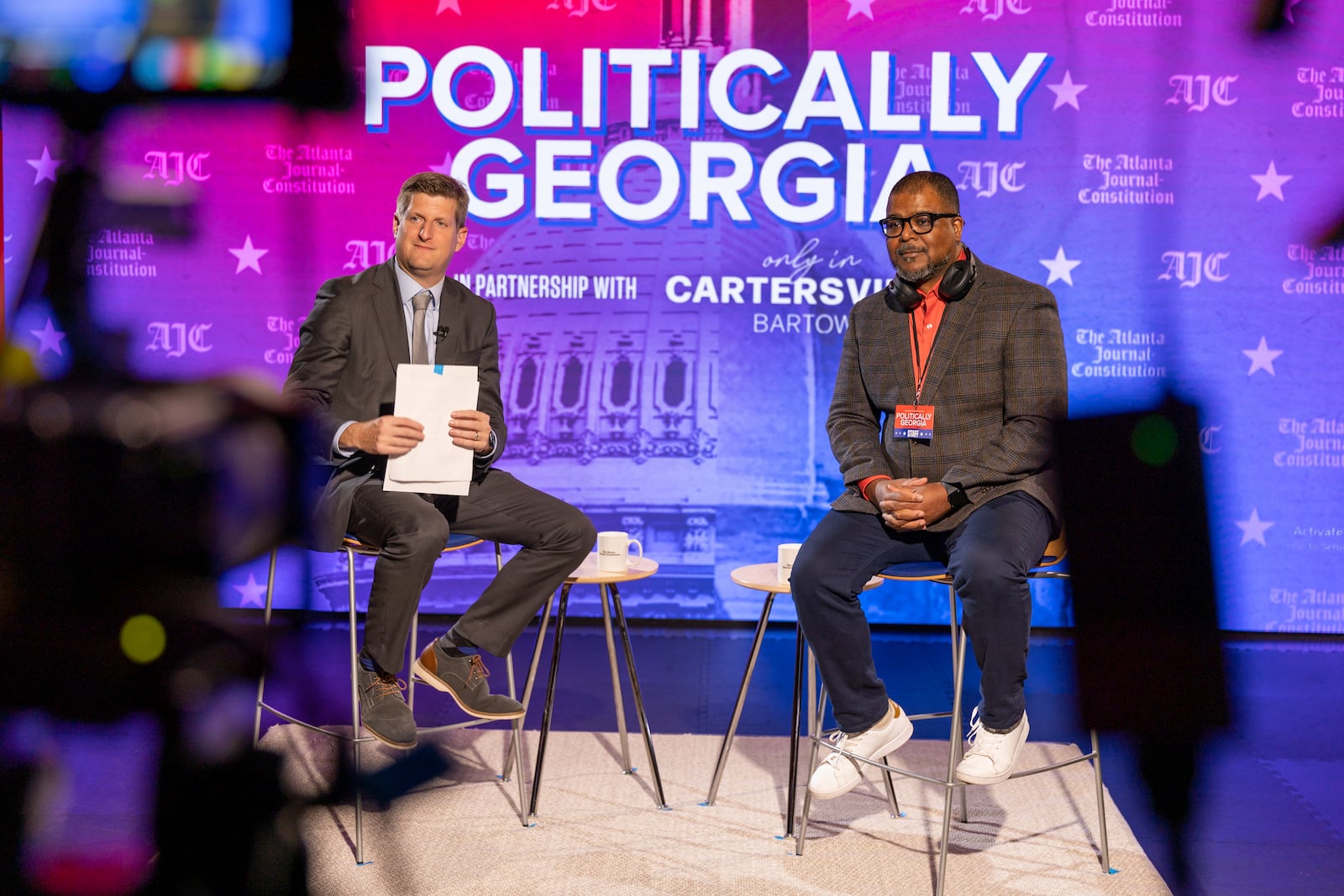 AJC reporter Greg Bluestein (left) and editor-in-chief Leroy Chapman before an AJC Town Hall on Jan. 26, 2024. (Arvin Temkar/arvin.temkar@ajc.com)