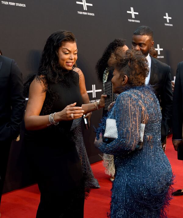 October 5, 2019 Atlanta -  Oscar nominee Taraji P. Henson greets legendary R&B singer Anita Baker on the red carpet. It was a star-studded event at the opening of Tyler Perry Studios Saturday, October 5, 2019 in Atlanta. Perry acquired the property of Fort McPherson to build a movie studio on 330 acres of land. (Ryon Horne / Ryon.Horne@ajc.com)