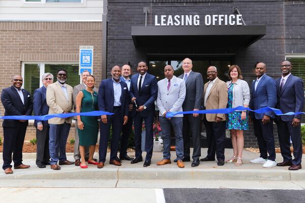 Atlanta Mayor Andre Dickens joins Grove Park Foundation executive director Gavin McGuire and Columbia Residential staff members to cut the ribbon for a 110-unit affordable housing apartment complex in February 2022 in Atlanta, Georgia. (Quinn West)