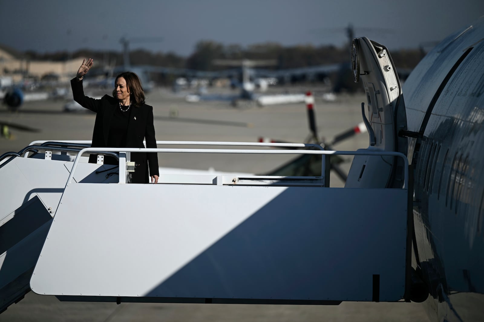 Democratic presidential nominee Vice President Kamala Harris waves as she boards Air Force Two, Wednesday, Oct. 30, 2024, at Joint Base Andrews, Md. (Brendan Smialowski/Pool via AP)