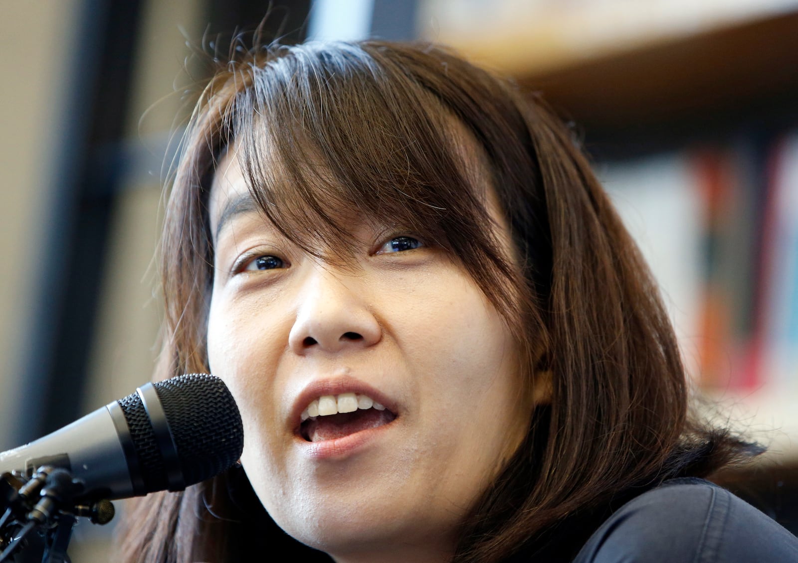 FILE - South Korean author Han Kang answers a reporter's question during a news conference in Seoul, South Korea, Tuesday, May 24, 2016, who has been awarded the Nobel Prize in literature. (AP Photo/Lee Jin-man, File)