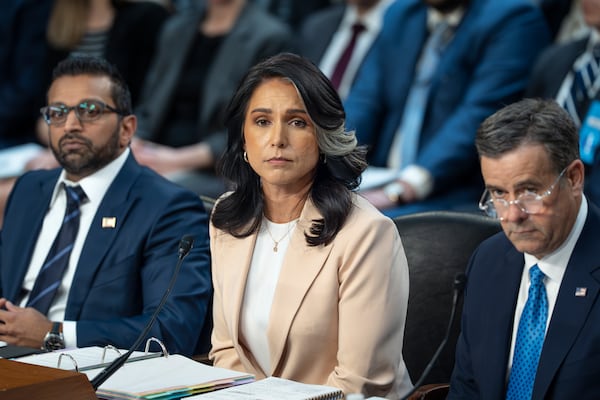 Director of National Intelligence Tulsi Gabbard, center, is flanked by FBI Director Kash Patel, left, and CIA Director John Ratcliffe, as the Senate Intelligence Committee holds its worldwide threats hearing, on Capitol Hill in Washington, Tuesday, March 25, 2025. (AP Photo/J. Scott Applewhite)