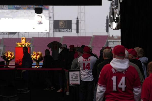 Baseball fans line up to pay their respects to Cincinnati Reds legend Pete Rose during a public visitation, Sunday, Nov. 10, 2024, at Great American Ball Park in Cincinnati. (AP Photo/Kareem Elgazzar)