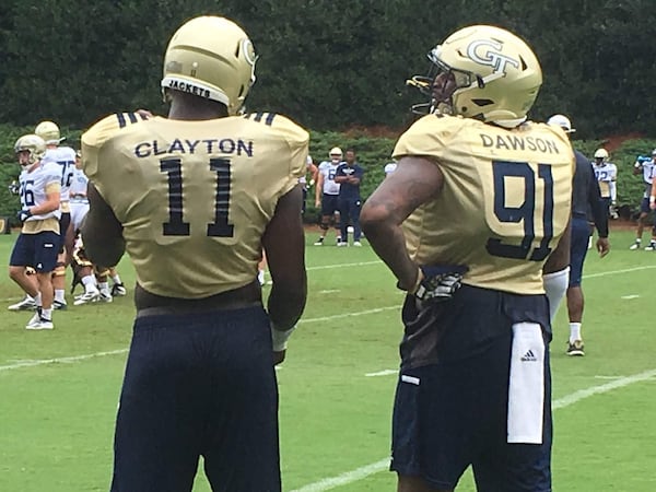 Georgia Tech defensive linemen Antonneous Clayton and Kelton Dawson converse on the sidelines Aug. 2, 2019, at Alexander Rose Bowl Field. 