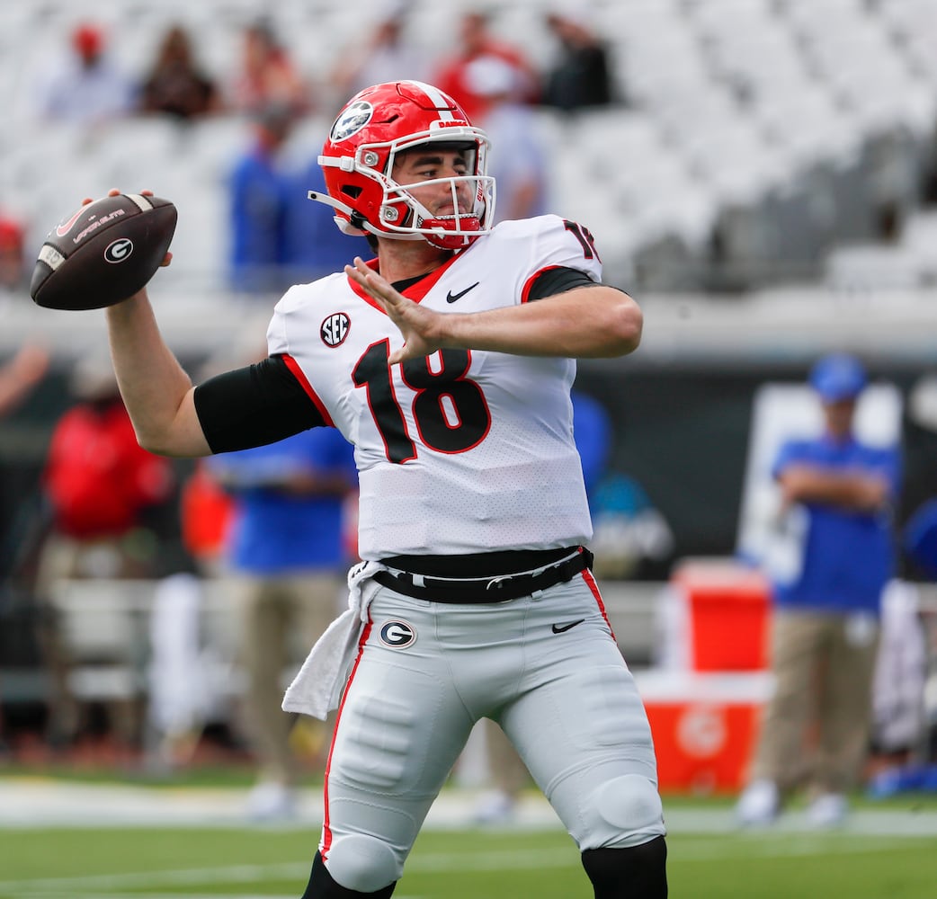 10/30/21 - Jacksonville -  Georgia Bulldogs quarterback JT Daniels (18) warms up before the game at the annual NCCA  Georgia vs Florida game at TIAA Bank Field in Jacksonville.   Bob Andres / bandres@ajc.com