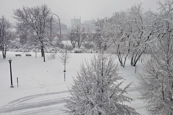 The heaviest snowfall of the season blankets Father Hennepin Park in Minneapolis and obscures the downtown skyline on Wednesday, March 5, 2025. (AP Photo/Steve Karnowski)