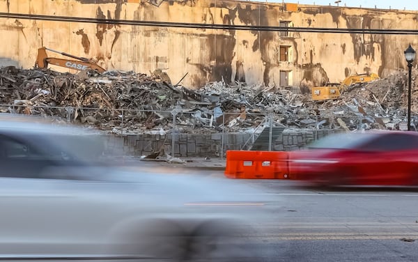 Traffic zooms by the ruins of the Reserve at LaVista Walk. 