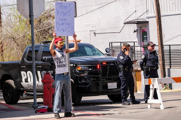 Indigo Beltran, 19, of Eagle Pass, holds a poster protesting the visit by Vice President JD Vance to the Texas - Mexico border in Eagle Pass, Texas, Wednesday, March 5, 2025. (AP Photo/Rodolfo Gonzalez)