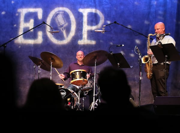 A few patrons look on from the shadows as Justin Varnes plays the drums leading his Justin Varnes Sextet in the first live concert at Red Clay Music Foundry since the pandemic closed its doors in March.  Curtis Compton ccompton@ajc.com