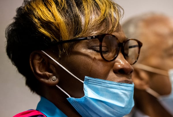 Tears streak down the cheek of Ahmaud Arbery's mother Wanda Cooper-Jones after the jury convicted Travis McMichael in the Glynn County Courthouse, Wednesday, Nov. 24, 2021, in Brunswick, Ga. (AP Photo/Stephen B. Morton, Pool)