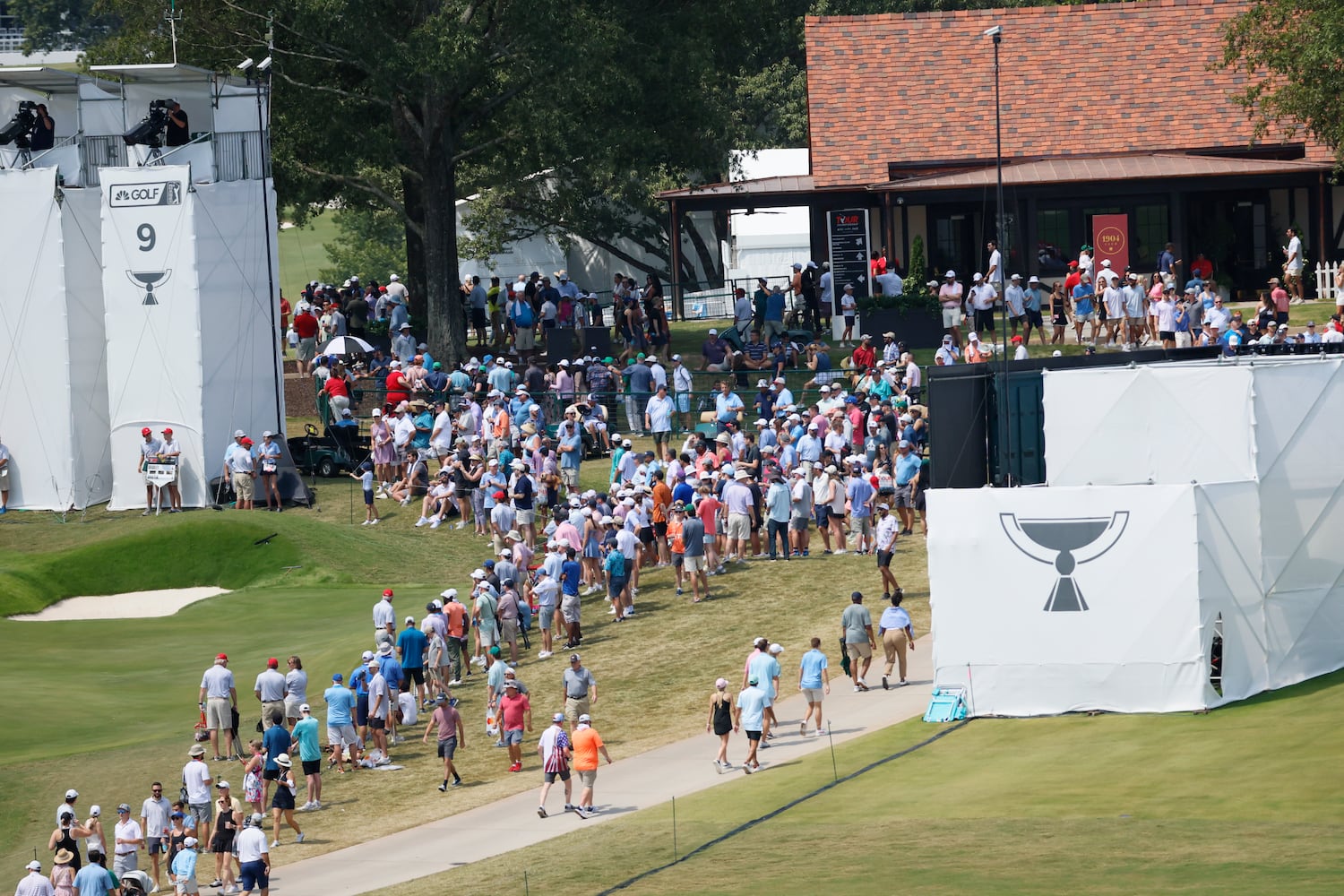 Fans walk near the ninth green during the final round of the Tour Championship at East Lake Golf Club on Sunday, Sept. 1, 2024, in Atlanta. 
(Miguel Martinez / AJC)