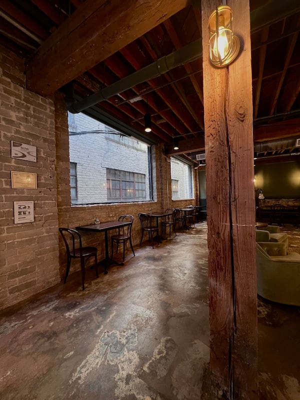 The 2,000-square-foot interior of Harbor Coffee has seating for about 30 customers. The space features exposed support beams made of old wood. / Courtesy of Harbor Coffee