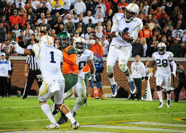 Defensive back Jamal Golden: He leaps to secure a game-clinching interception against Miami at Bobby Dodd Stadium on Oct. 4, 2014. (Photo by Scott Cunningham/Getty Images)