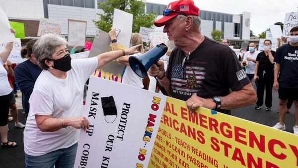 People protested before a recent Cobb school board meeting as mask debates continue to heat up. (file photo)