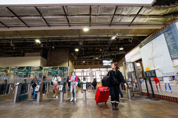 Passengers and travelers are seen leaving the MARTA station at  the airport on Tuesday, Feb. 27, 2024. The station is starting to work on a significant renovation and will close to the public on April 8th.
 Miguel Martinez /miguel.martinezjimenez@ajc.com