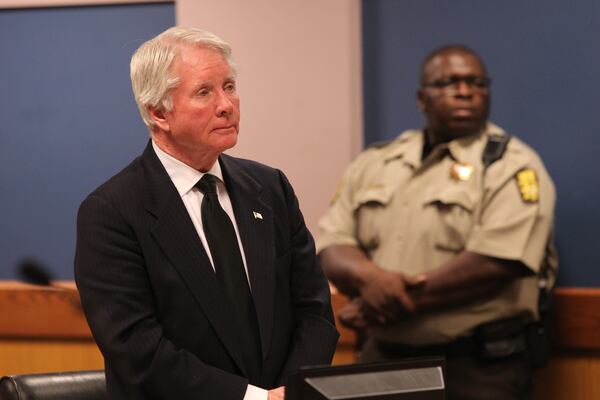 Tex McIver listens to Judge Robert McBurney's plan for the next appearance in court .  (HENRY TAYLOR / HENRY.TAYLOR@AJC.COM)