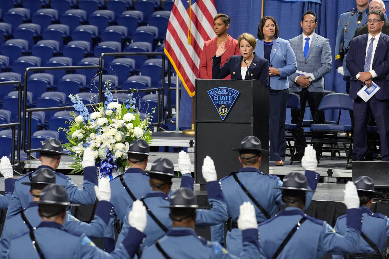 Massachusetts Gov. Maura Healey, front top, swears in the 90th Recruit Training Group of the Massachusetts State Police, Wednesday, Oct. 9, 2024, during ceremonies at the DCU Center, in Worcester, Mass. (AP Photo/Steven Senne)