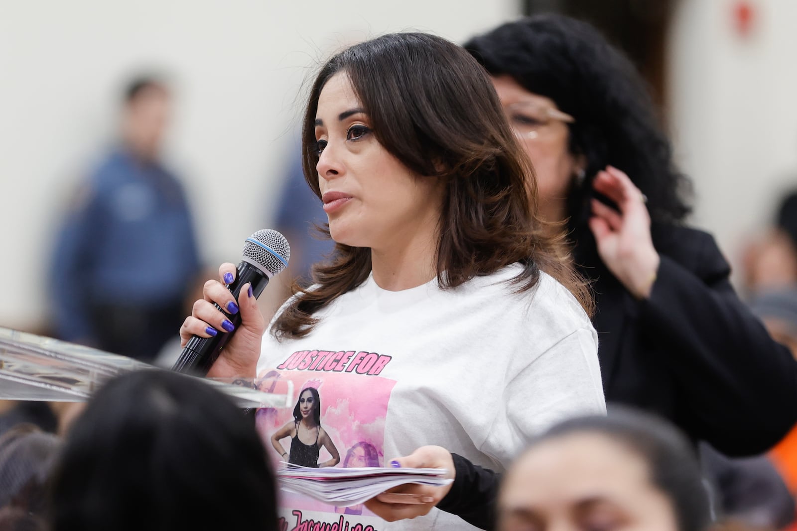 Anna Montalvo, whose 15 year old daughter Ximena died from a Fetanyl overdose in 2021, asks questions during a town hall to address youth violence in Gwinnett at Universal Church in Norcross on Thursday, March 9, 2023. (Natrice Miller/ Natrice.miller@ajc.com)