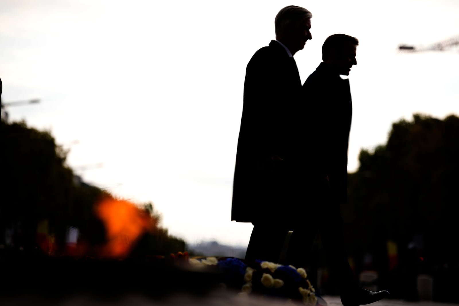 French President Emmanuel Macron, right, and Belgium's King Philippe attend a ceremony at the tomb of the Unknown soldier under the Arc de Triomphe, in Paris, Monday, Oct. 14, 2024. (AP Photo/Louise Delmotte)