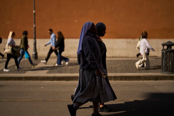 Catholic nuns walk outside the Vatican city, in Rome, Italy, Friday, March 7, 2025. (AP Photo/Francisco Seco)