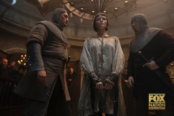 This image released by Fox Nation shows Liah O'Prey as Joan of Arc, center, in a scene from "Martin Scorsese Presents: The Saints," a new docudrama series by Martin Scorsese. (Slobodan Pikula/Fox Nation via AP)