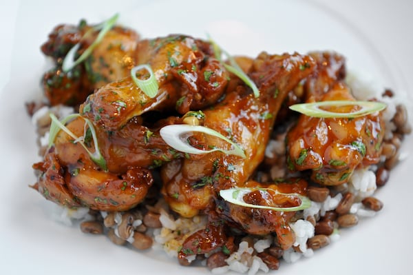 140123-ATLANTA- GA-Wings and Things at Empire State South in midtown Atlanta on Thursday January 23, 2014. Grass Roots Braised Hot Wings - Carolina Gold Rice, Sea Island red peas, ESS hot sauce, cilantro. (BECKY STEIN)