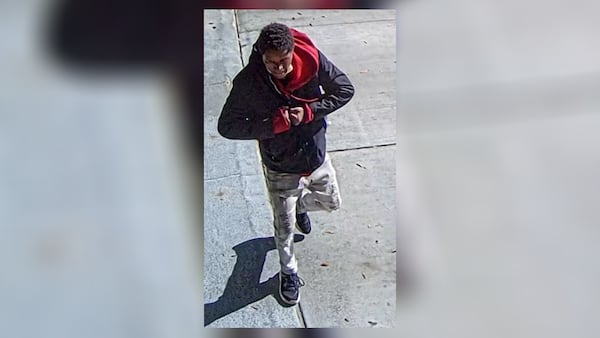 Atlanta police released photos of a man suspected of injuring a woman when he punched her in the face on Baker Street near Centennial Olympic Park.